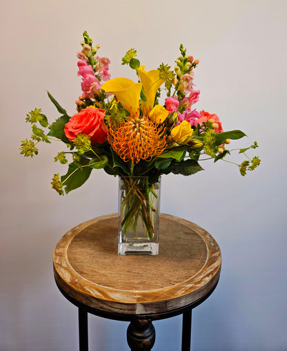 Summer glow Arrangement with bright pink and yellow flowers