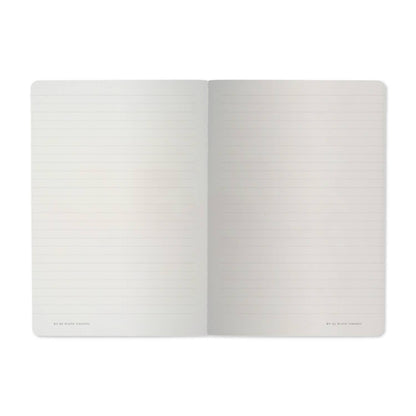 Open notebook with two blank pages on a white background